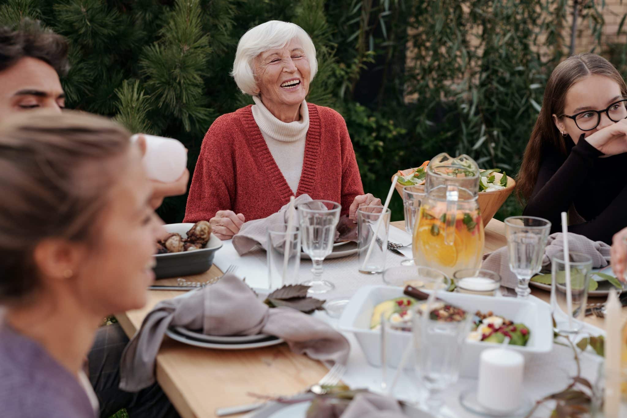 Family enjoying dinner outside.